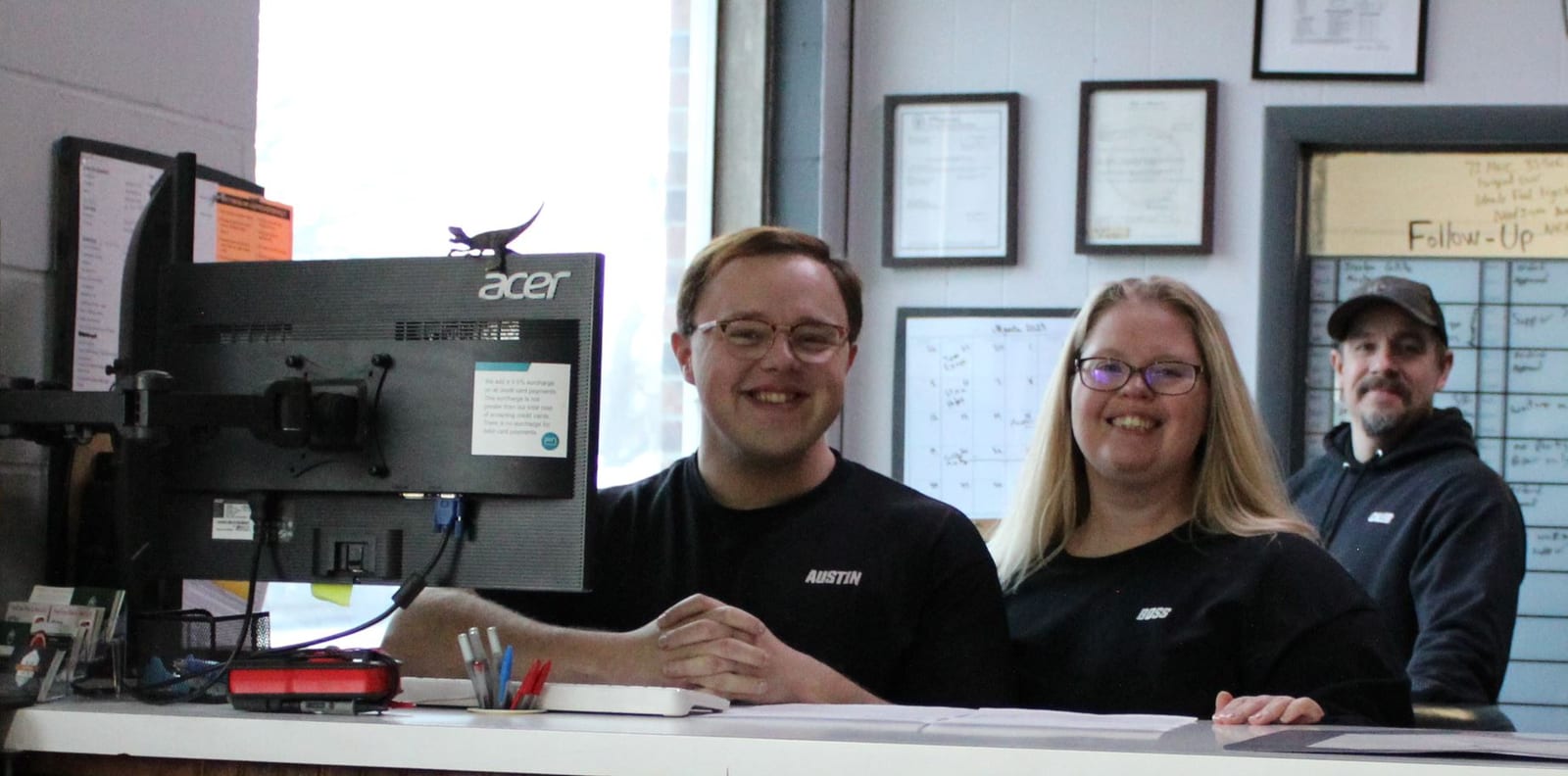 Kirksville Autoworks staff behind the counter